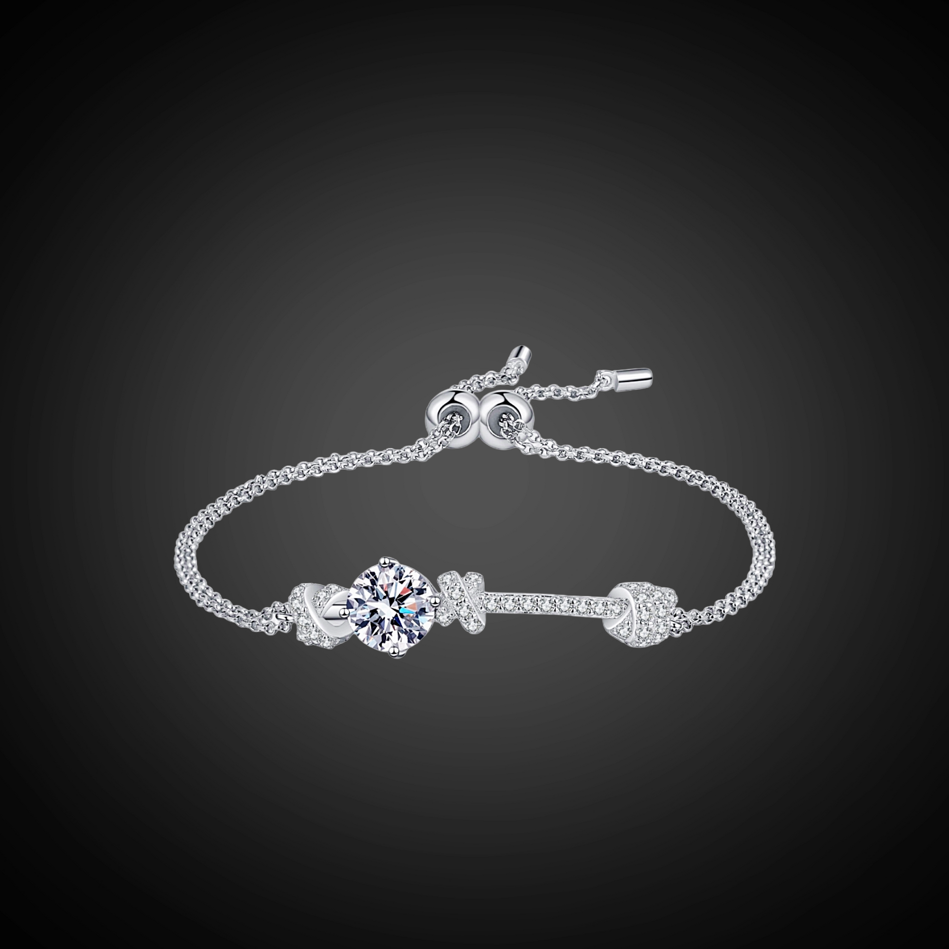 Silver bracelet with a decorative clasp on a black background