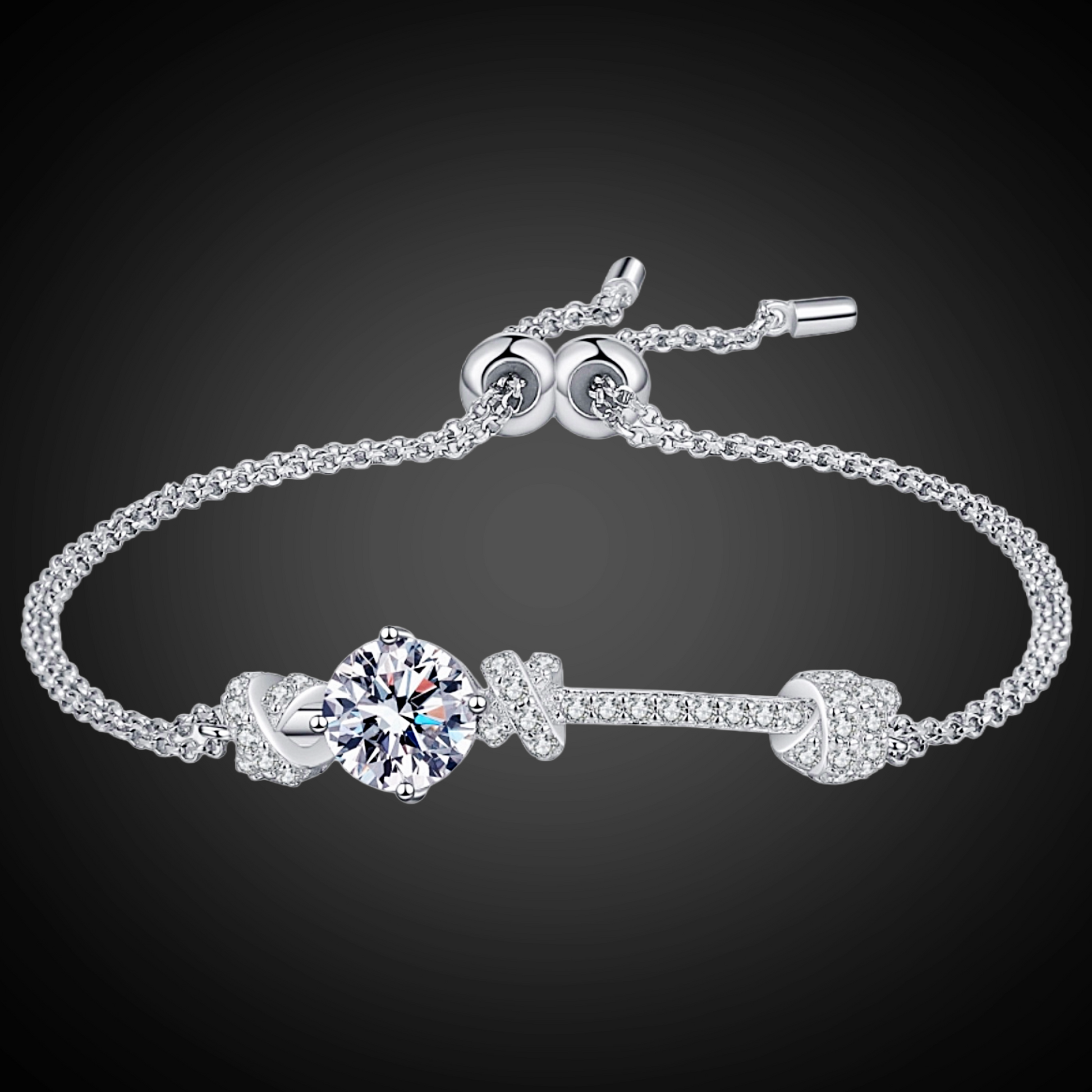 Silver bracelet with a central gemstone on a dark background