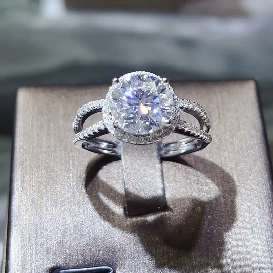 Diamond ring on a gray box with a blurred background