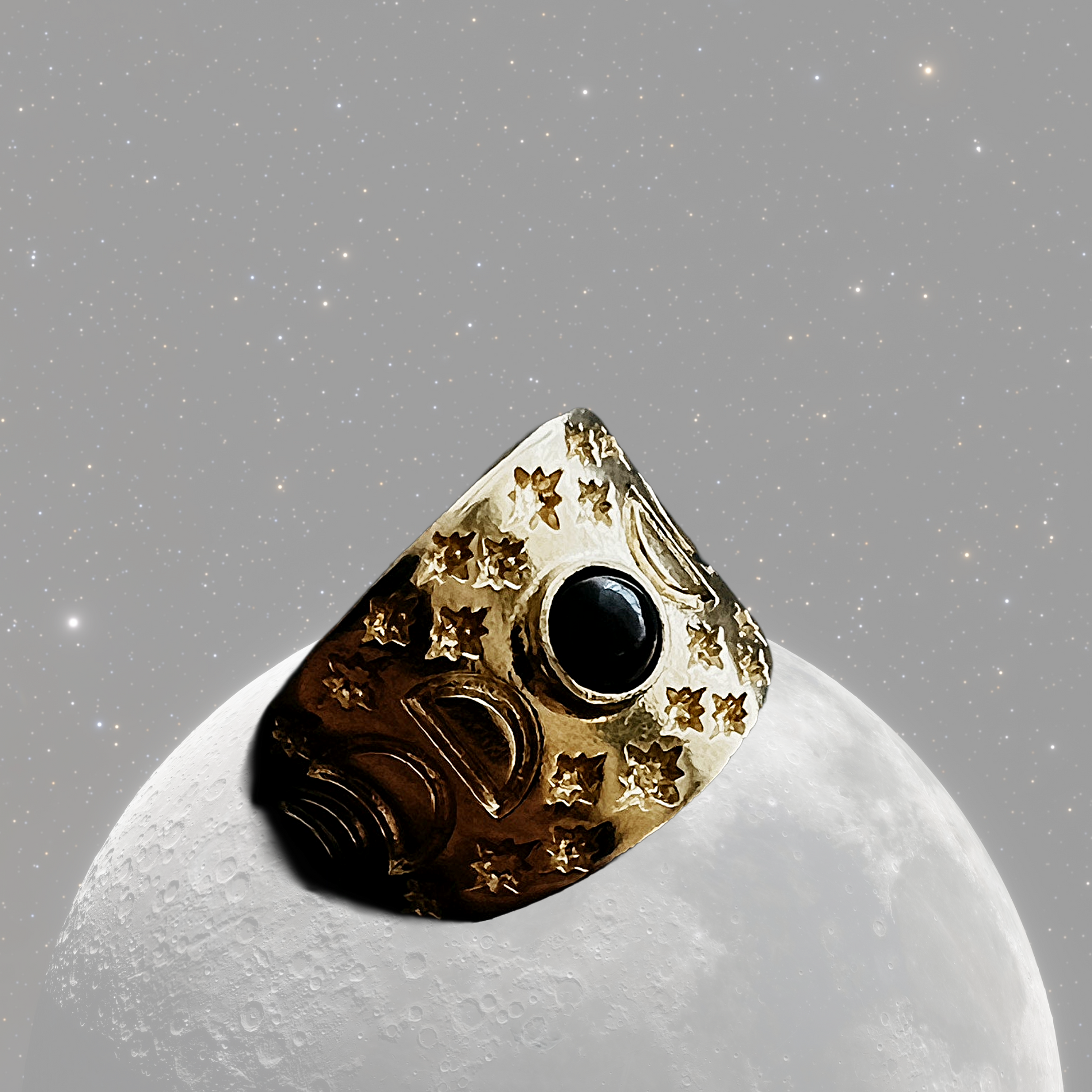 Decorative ring with gold and black design on a gray background