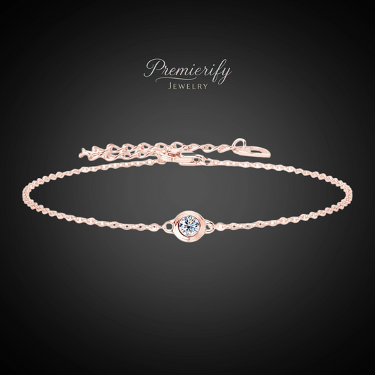 Rose gold bracelet with a central gemstone on a dark background, branded 'Premierify Jewelry'.