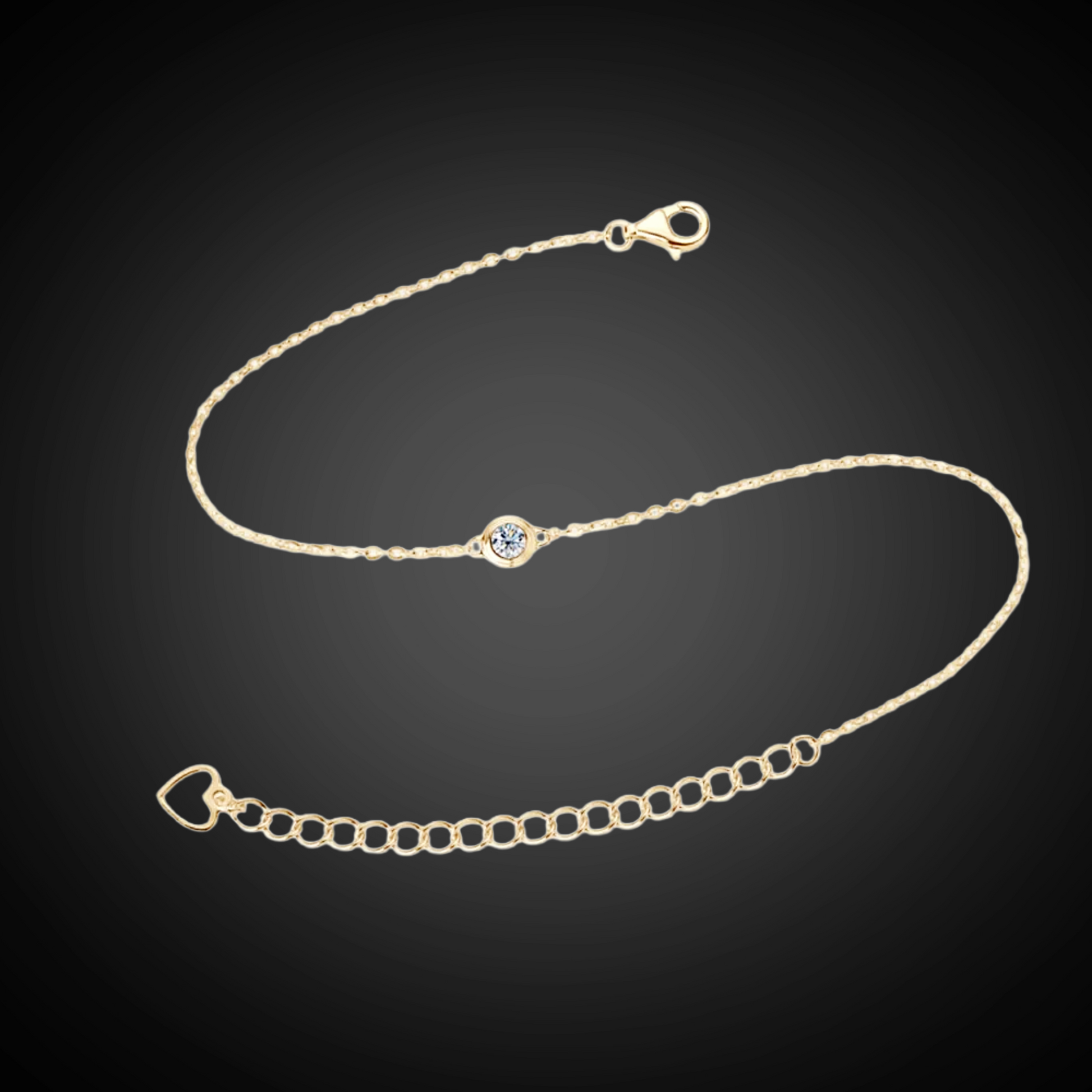 Gold bracelet with a small blue gemstone on a black background