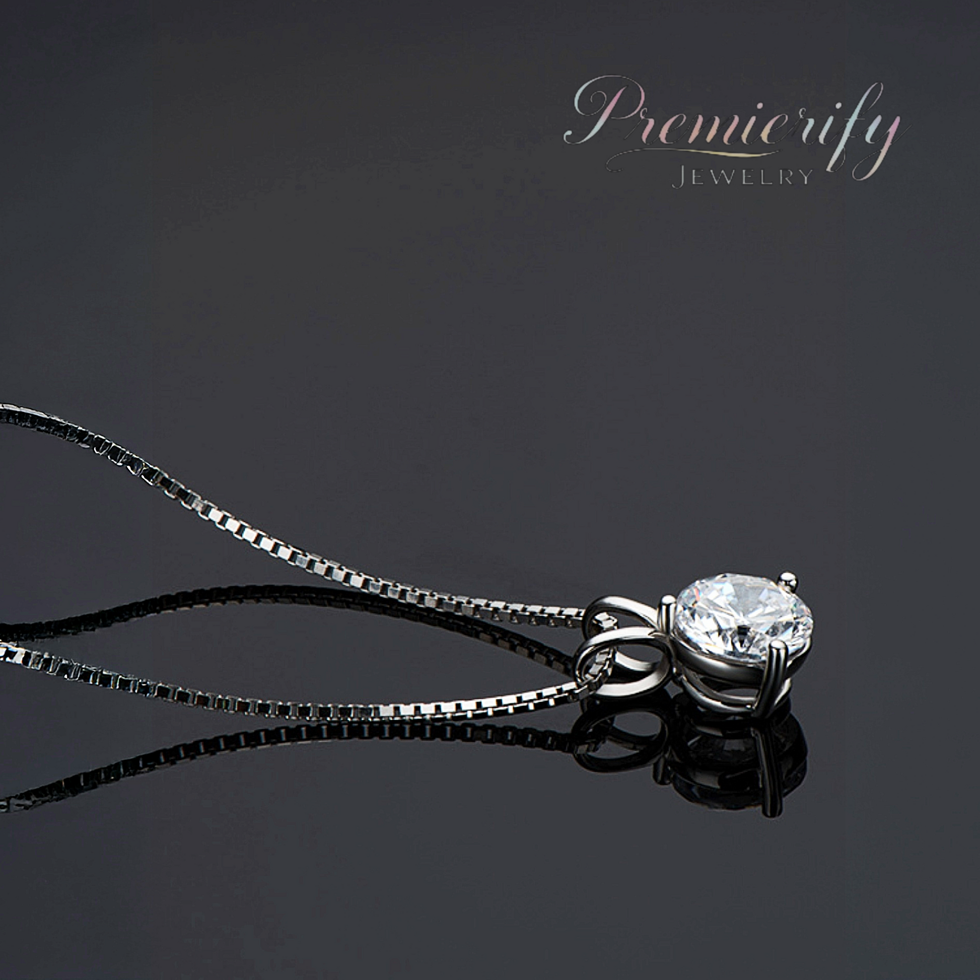Silver necklace with a diamond pendant on a dark background, featuring the brand 'Premierify Jewelry'.