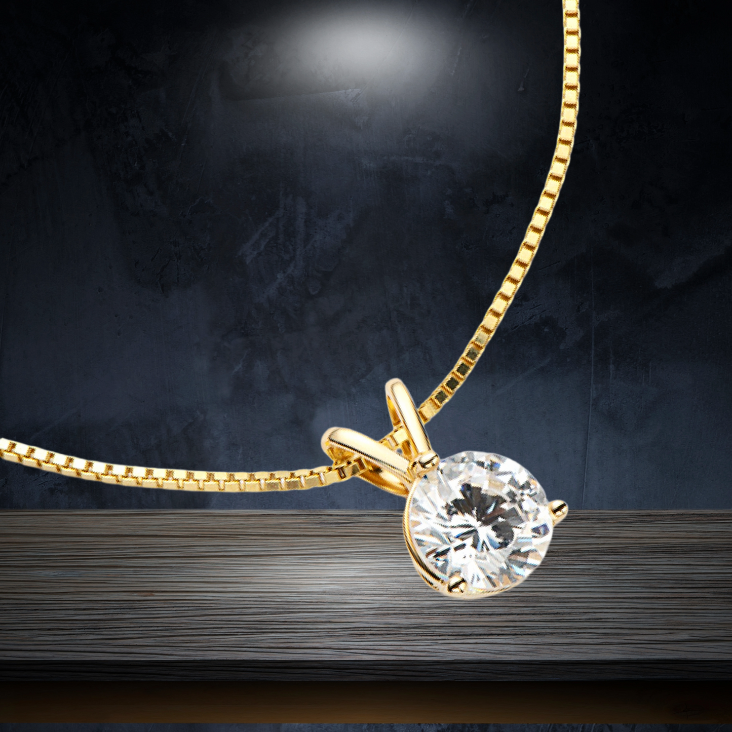 Gold necklace with a diamond pendant on a dark background