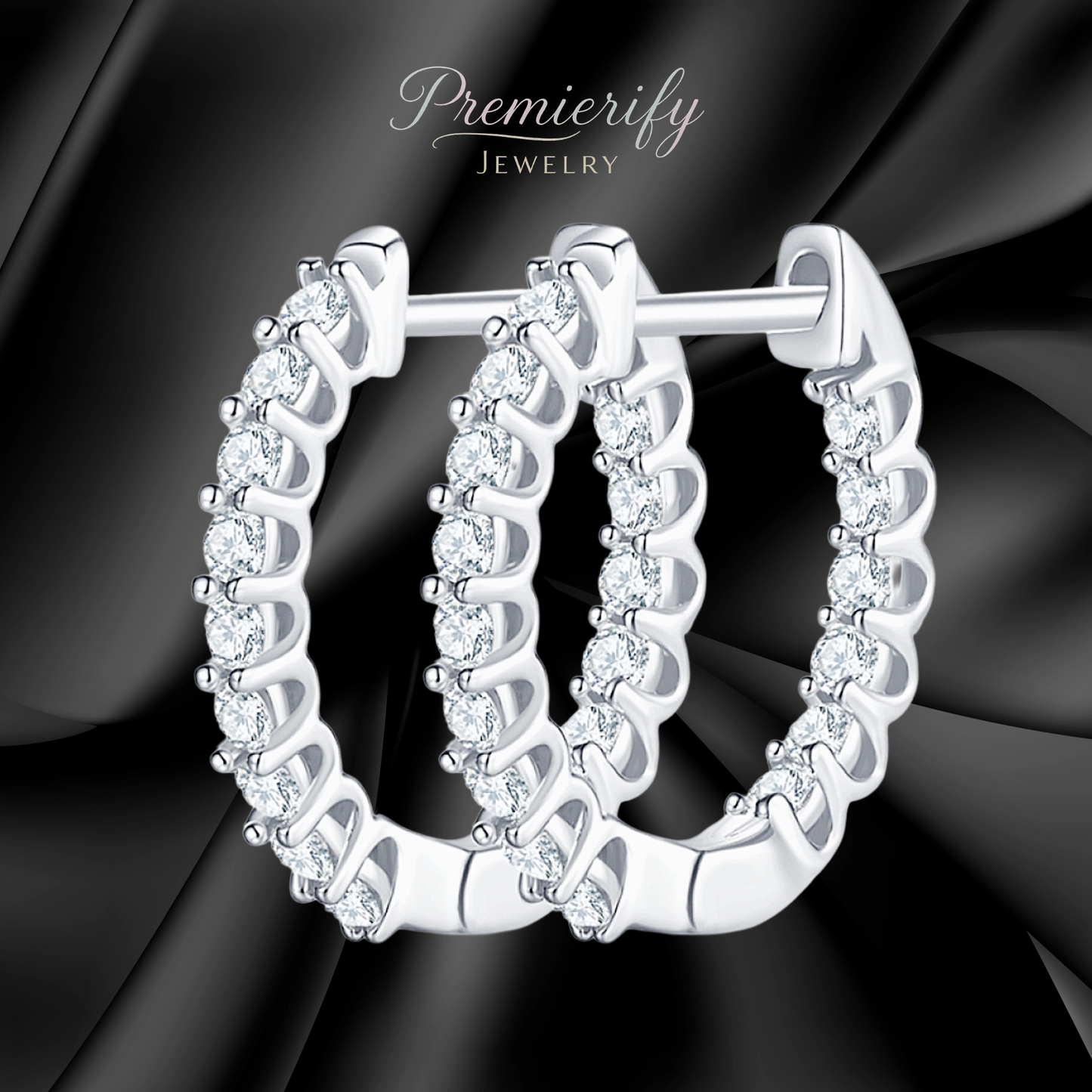 Silver hoop earrings with clear stones on a black satin background, branded 'Premierify Jewelry'.