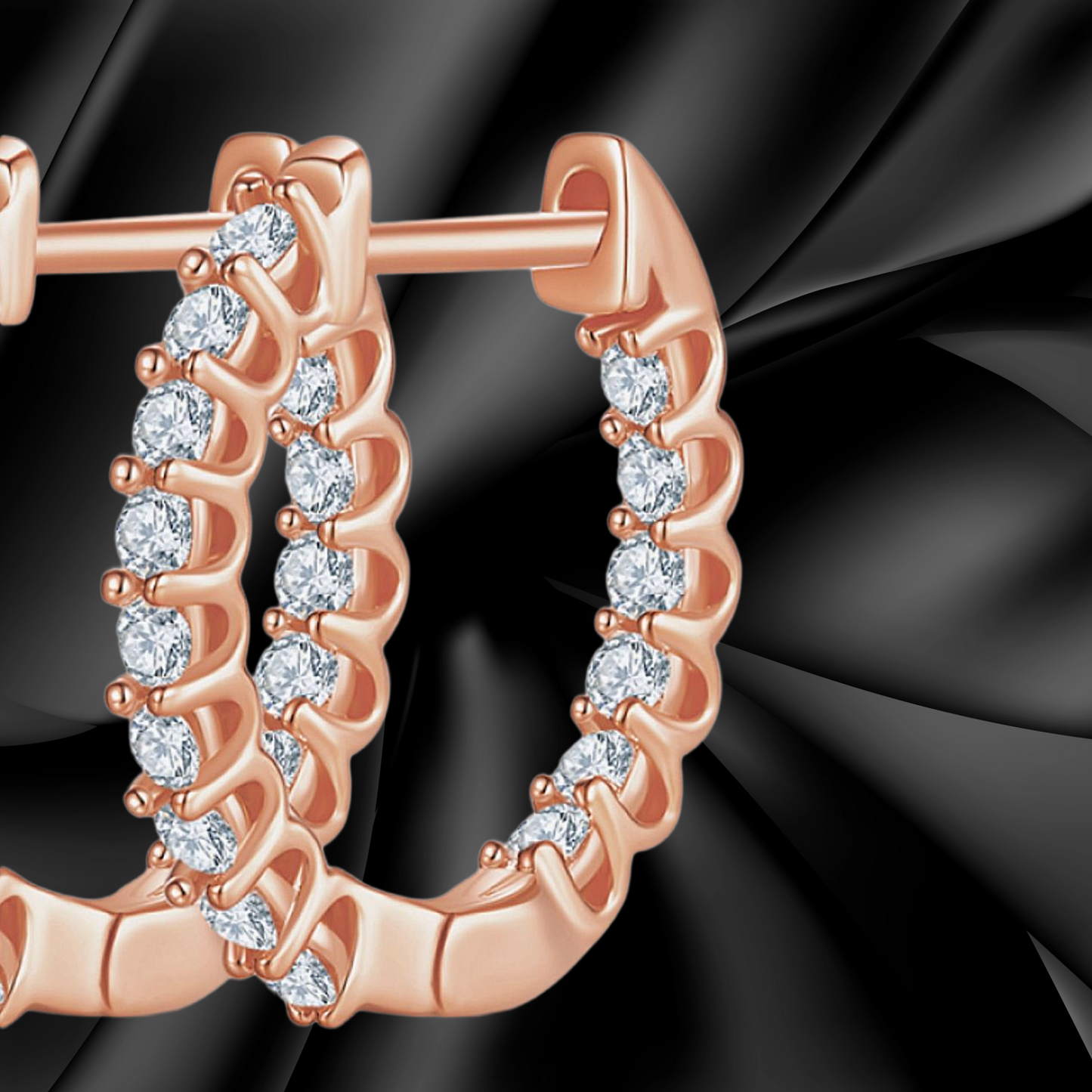 Rose gold hoop earrings with diamonds on a black background