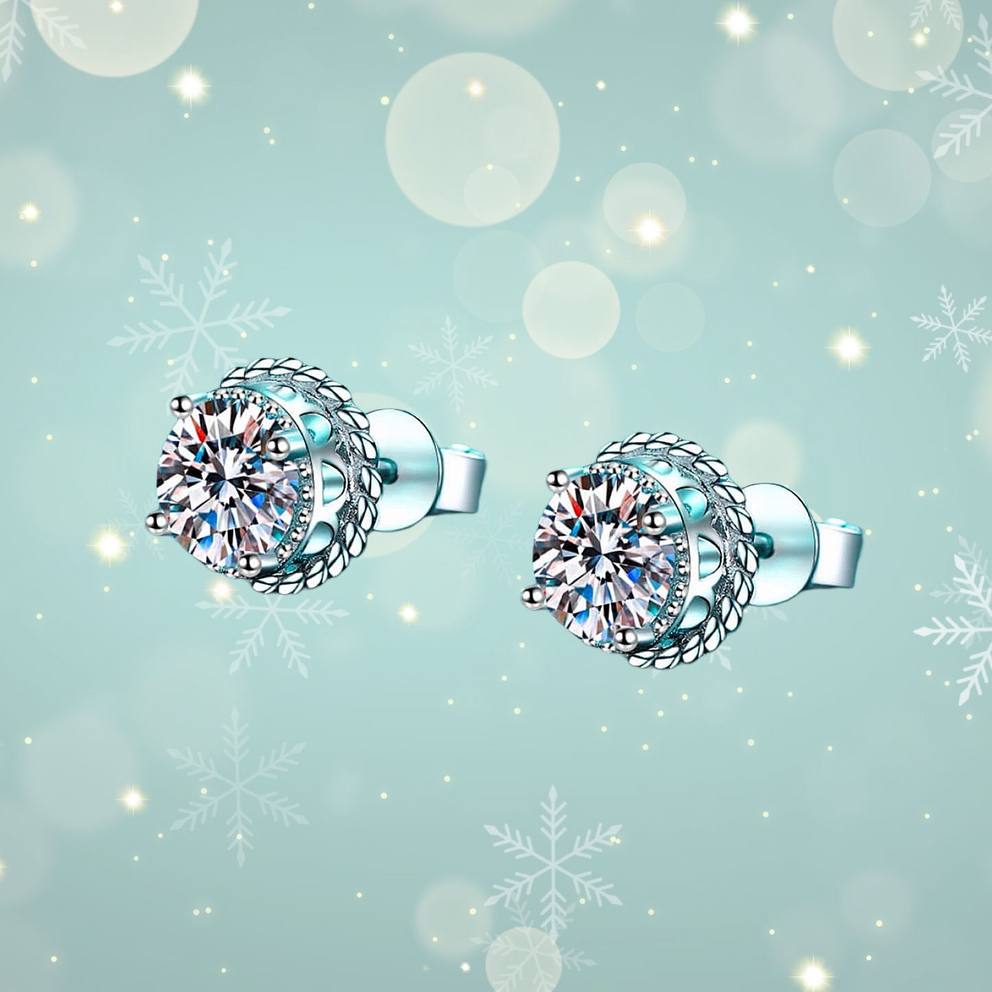 Pair of silver earrings with large gemstones on a light blue background with snowflakes.