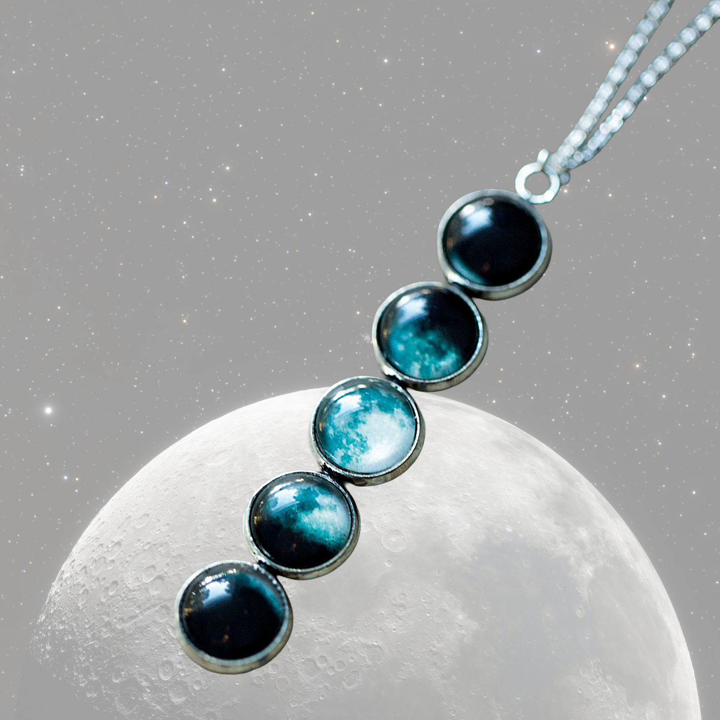 Necklace with blue and black beads against a moonlit sky background