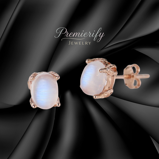 Pearl earrings with rose gold setting on black fabric, featuring 'Premierify Jewelry' branding.