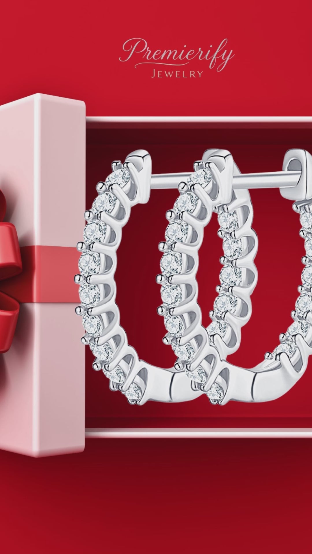 Silver moissanite hoop earrings on red gift bakground.