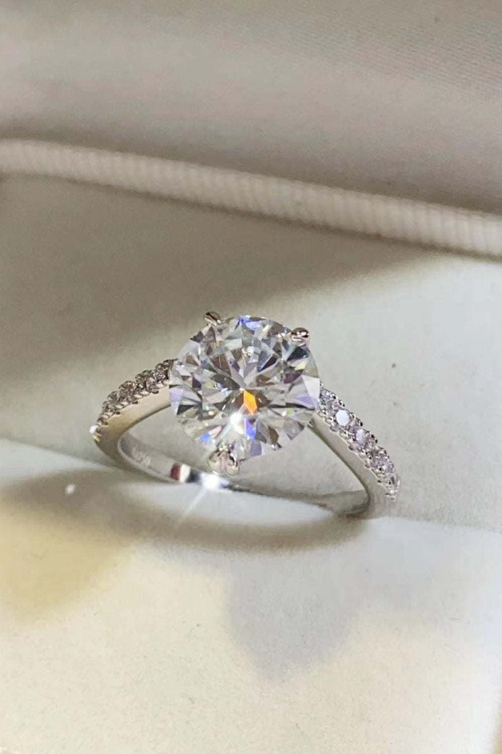 Pure Fire™ 3ct moissanite ring in platinum-plated 925 sterling with zircon accents; includes a certificate of authentication.