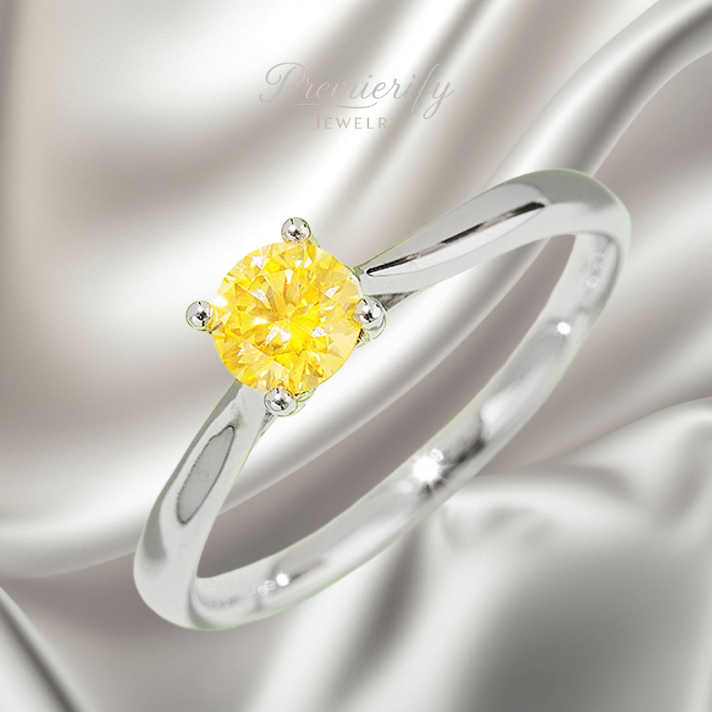 Silver ring with a yellow gemstone on a silver background