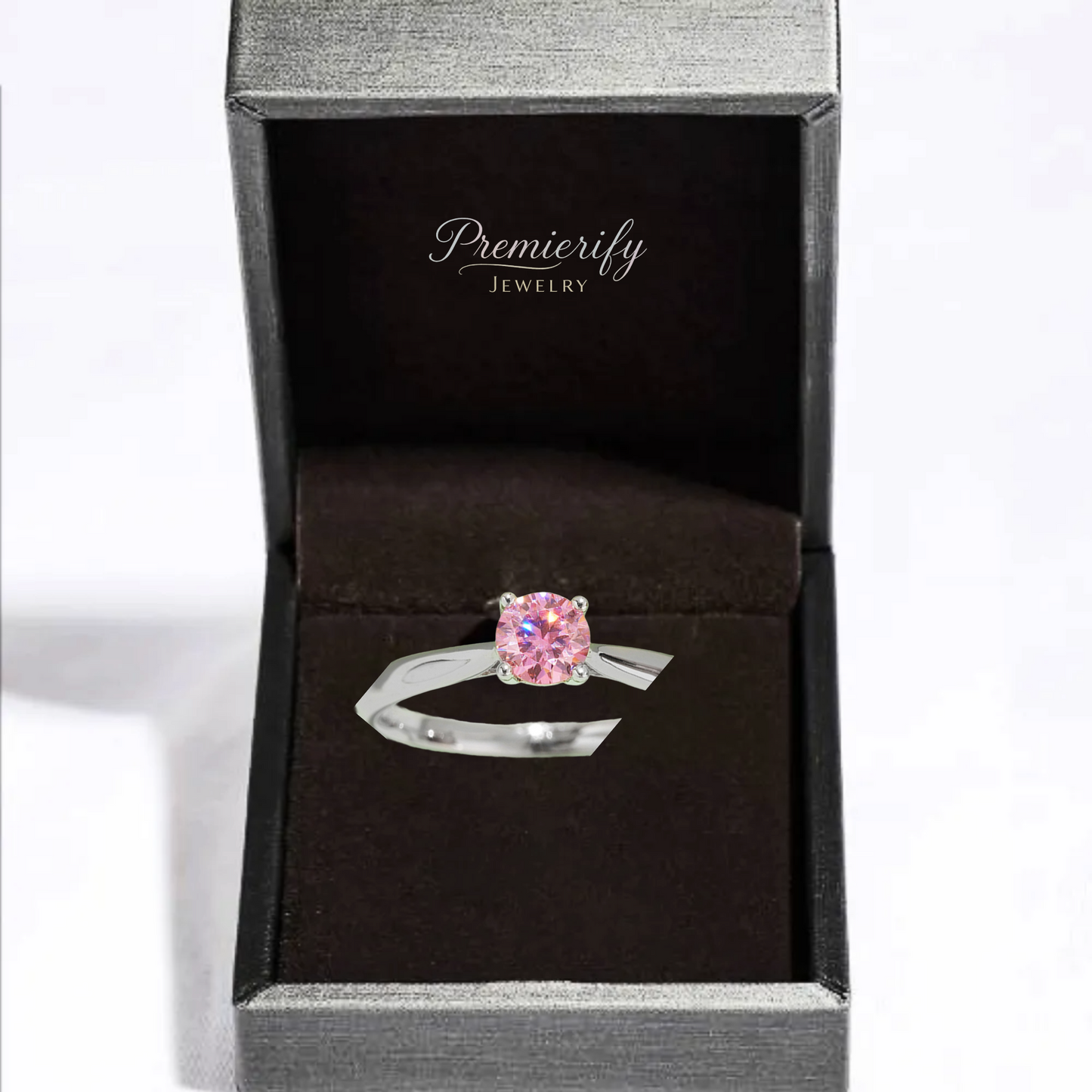 Pink gemstone ring in a Premierify Jewelry box on a white background