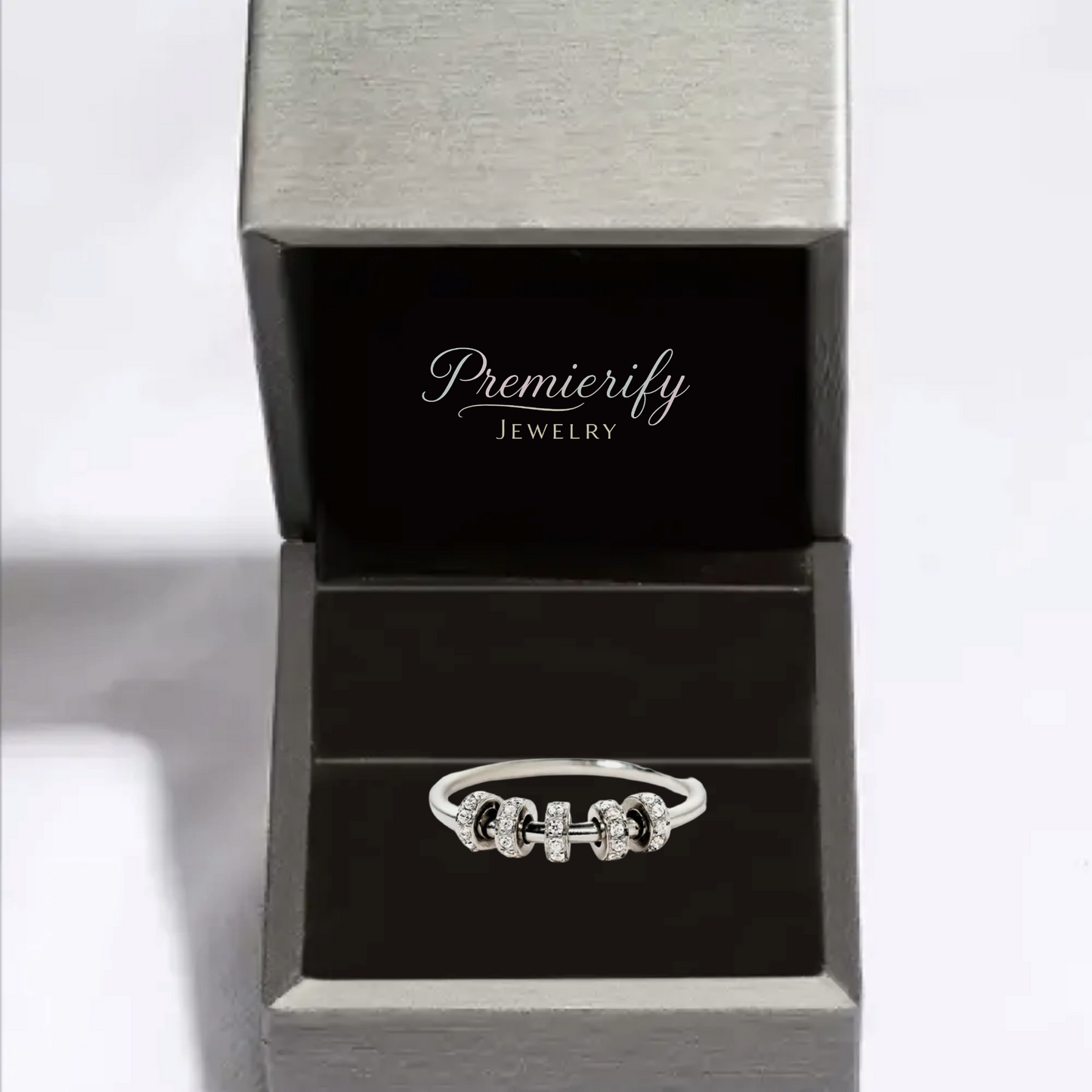 Silver ring in an open Premierify Jewelry box on a white background