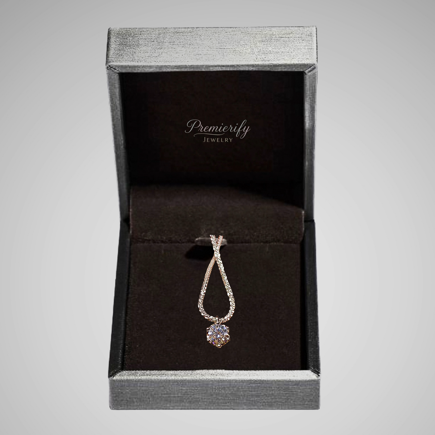 Diamond pendant in a Premierify Jewelry box on a gray background