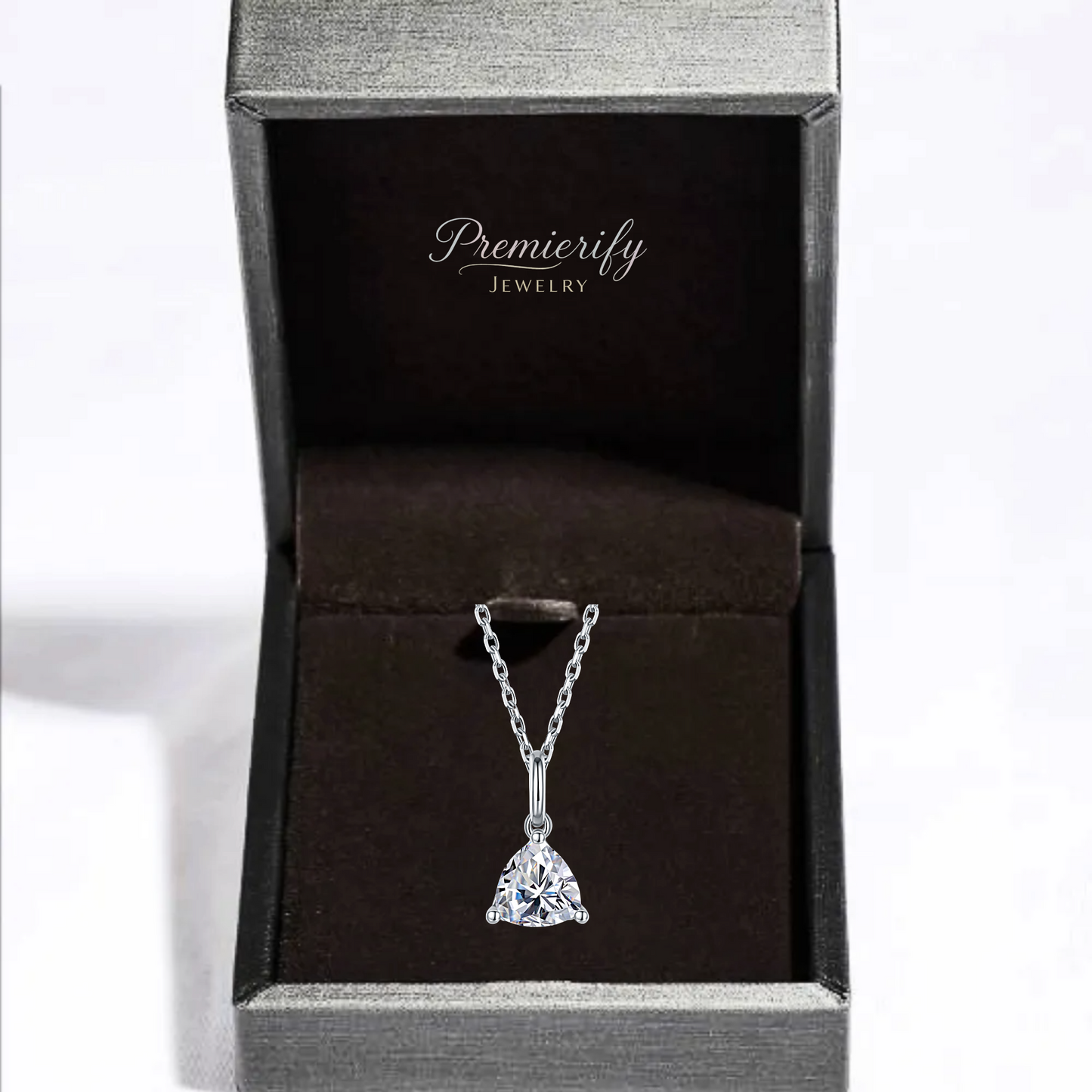Silver necklace with a clear pendant in a Premierify Jewelry box.
