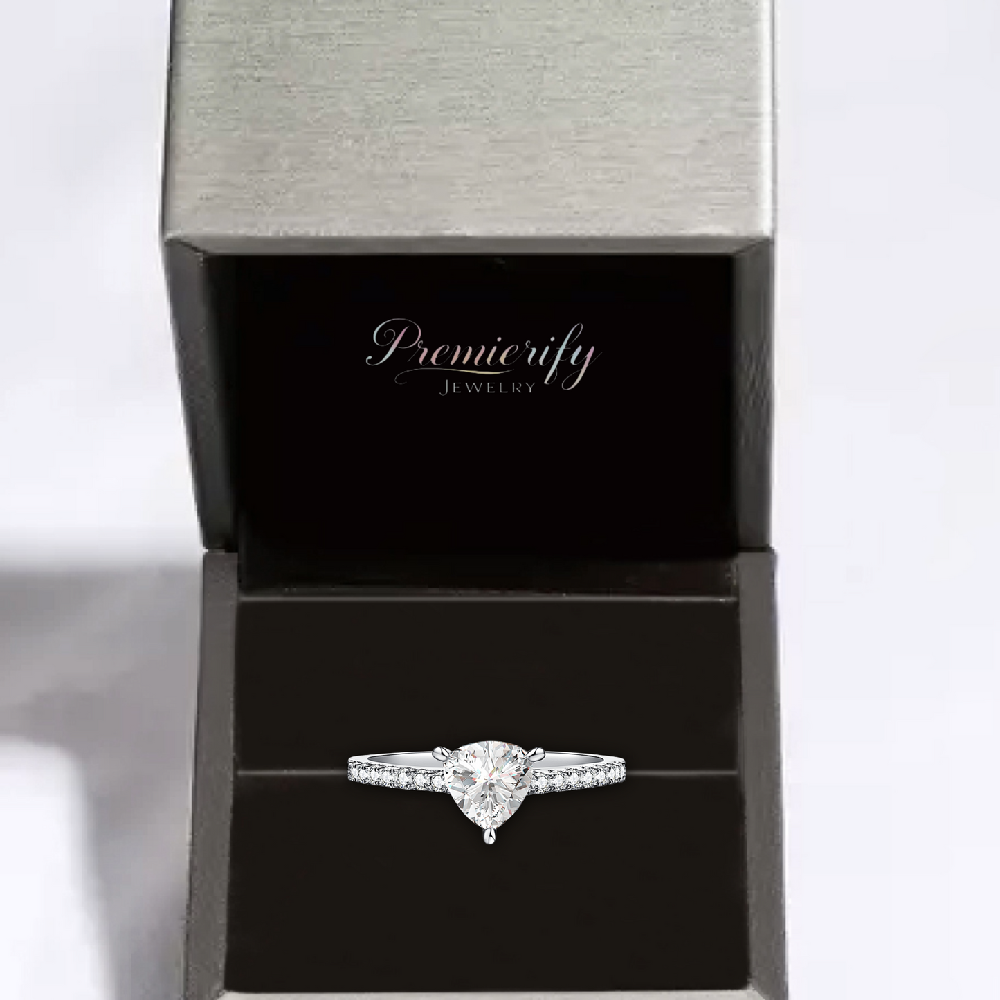 Diamond ring in a Premierify Jewelry box on a light gray background