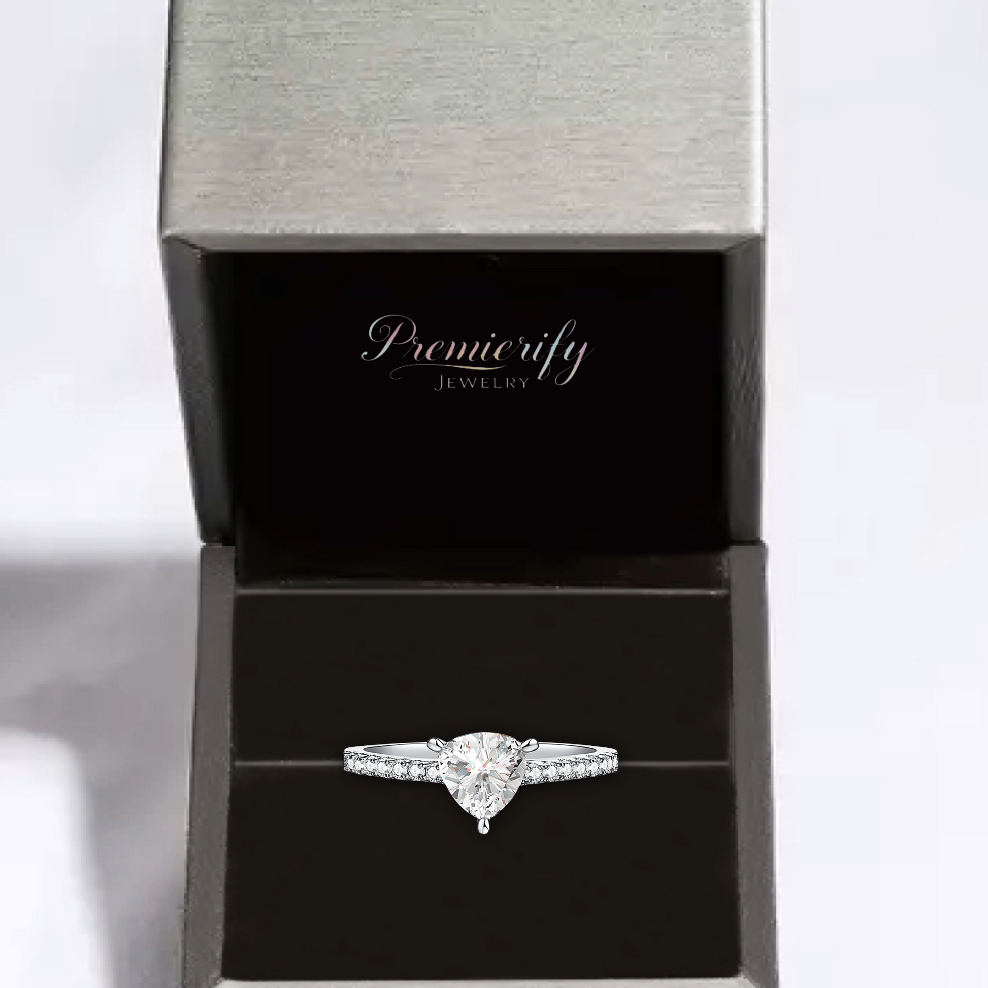 Diamond ring in a Premierify Jewelry box on a light gray background